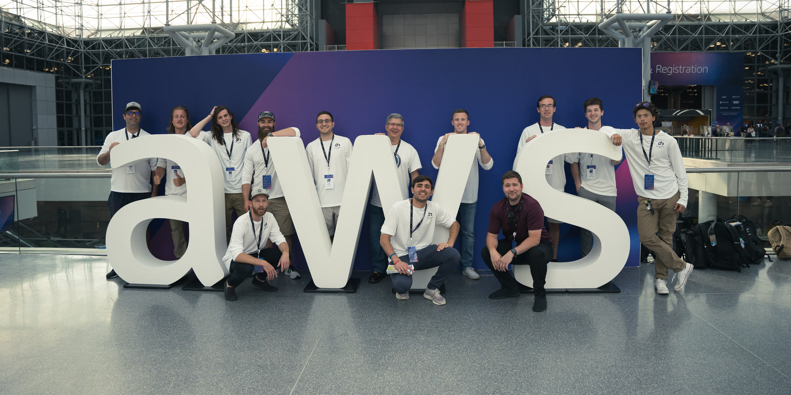 Jahnel Group team posing with the AWS letters at AWS Summit New York